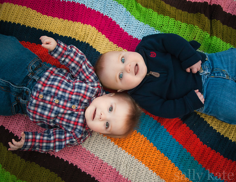 canton michigan twin brothers on colorful blanket