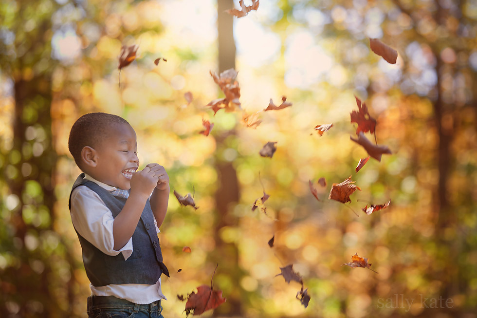michigan boy in fall leaves portrait