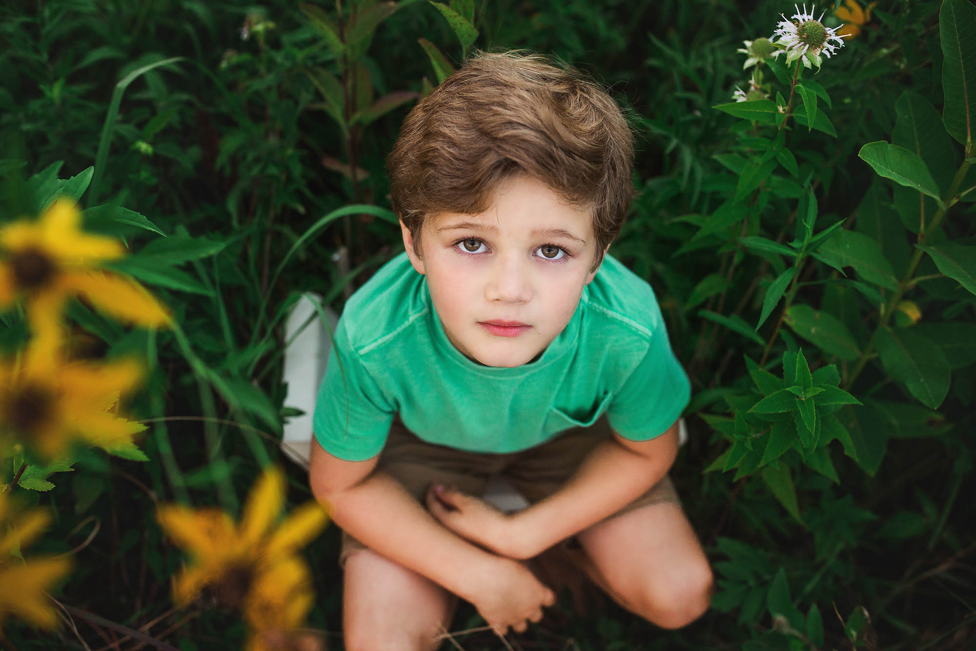 boy portrait in tall grass wisconsin