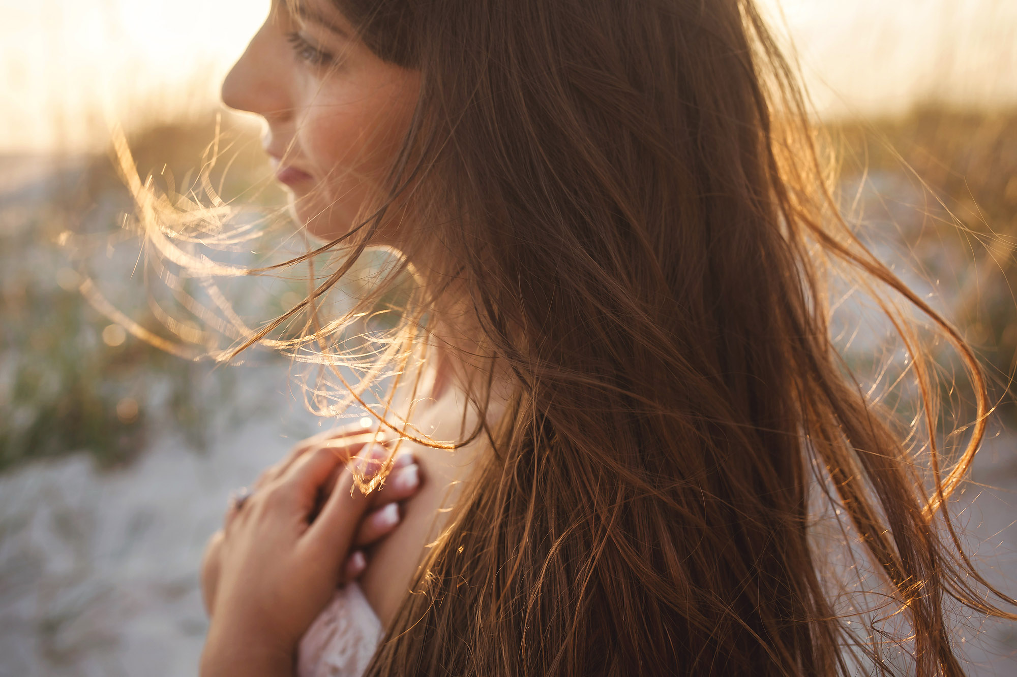 woman with long hair in sunlight