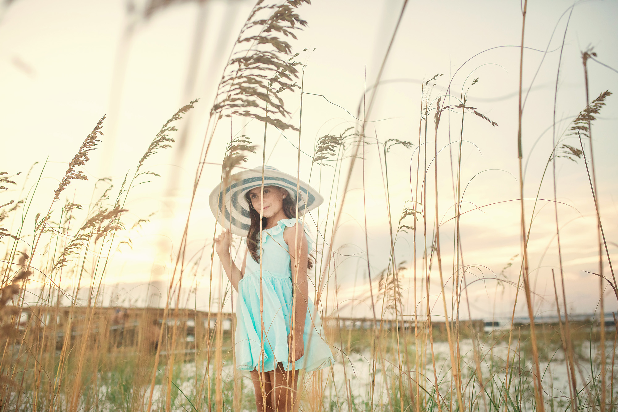 girl in tall grass beach photo