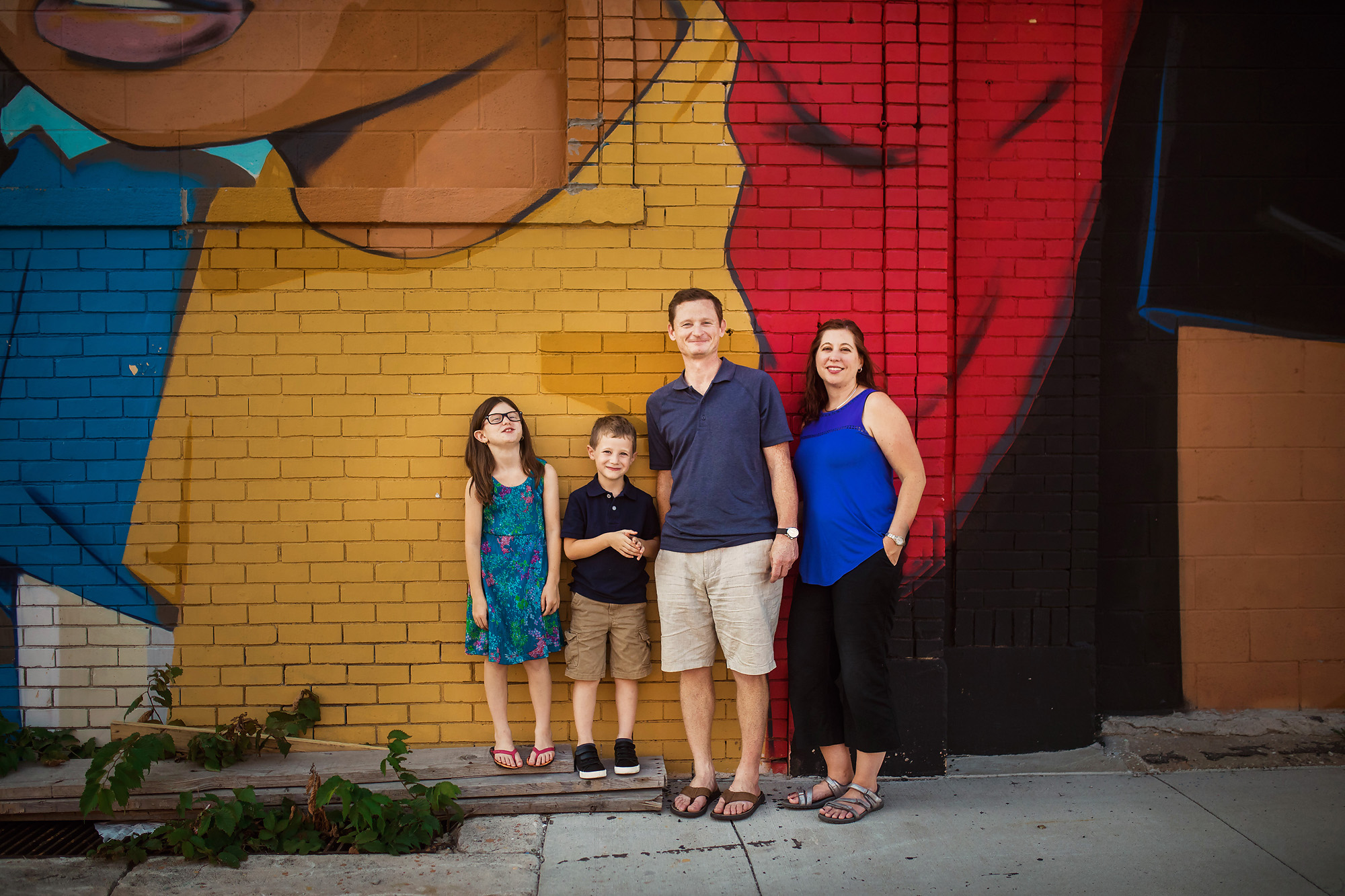 family of four murals detroit portraits