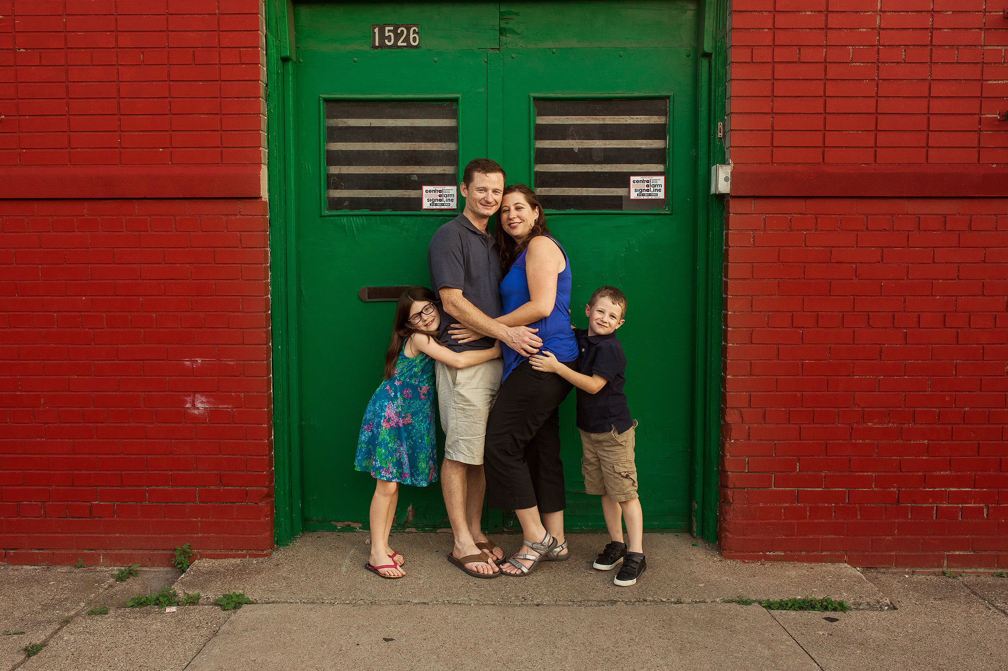 family by green door urban photo