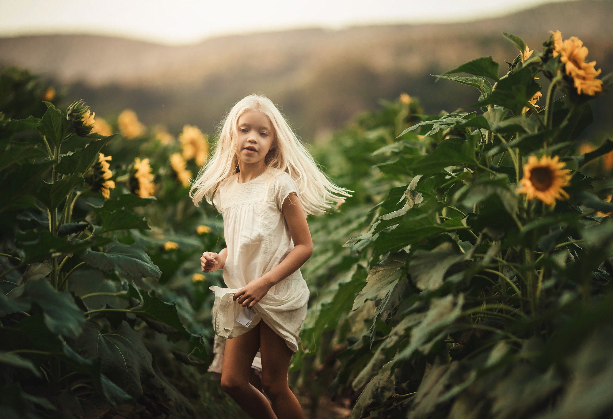 girl dancing in sunflowers atlanta