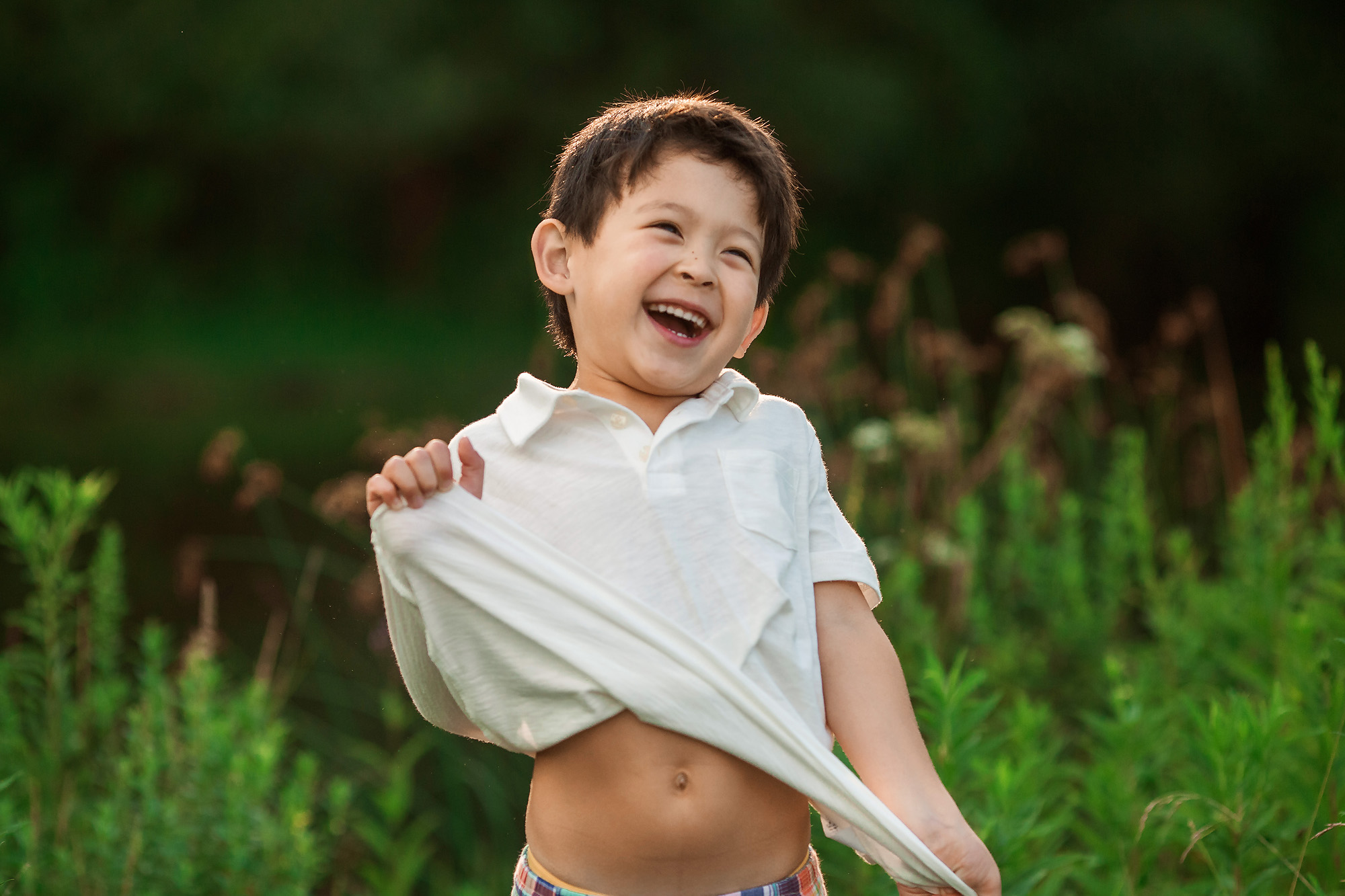 boy holding shirt silly photography