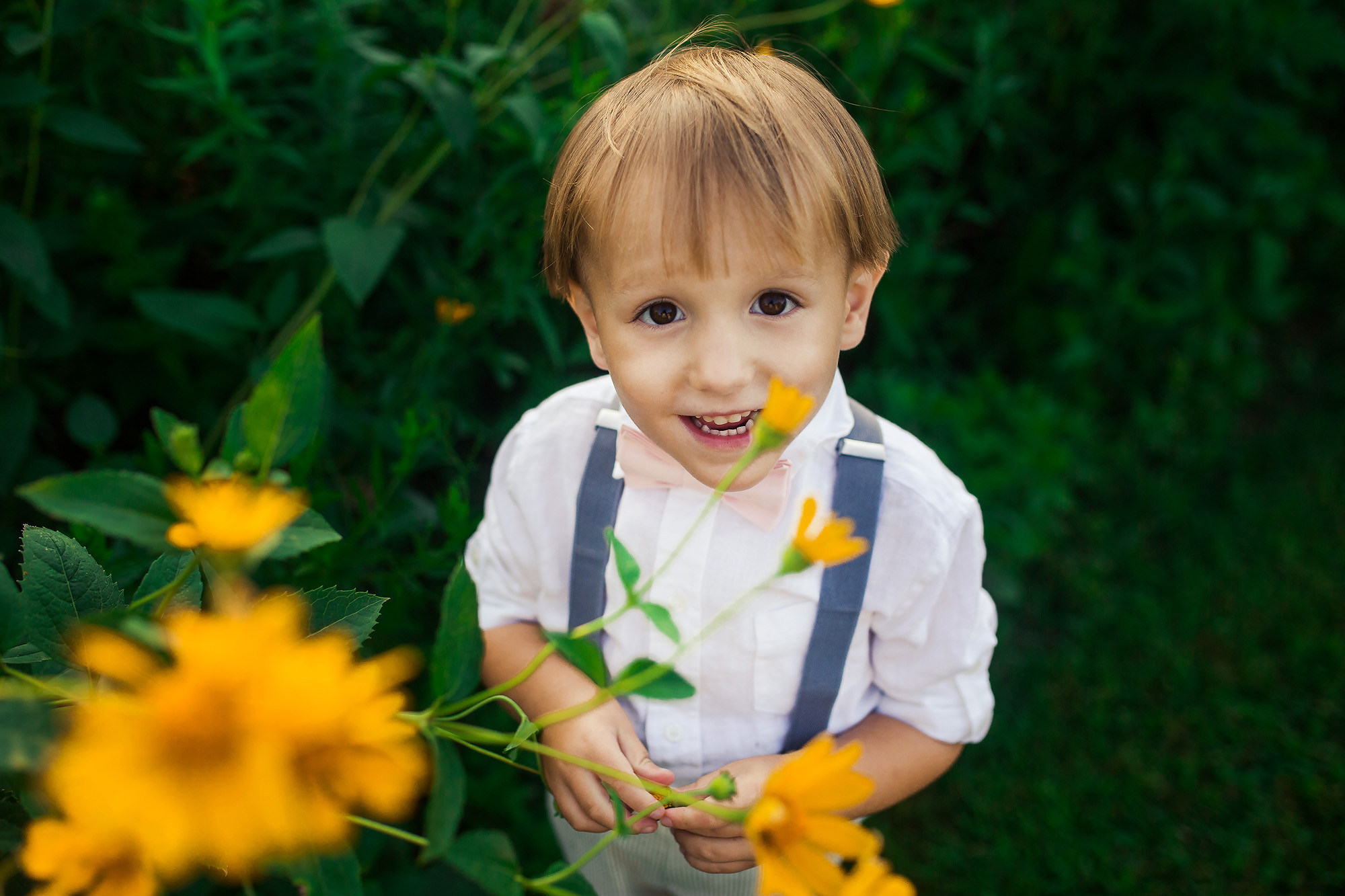 boy in yellow flowers portrait