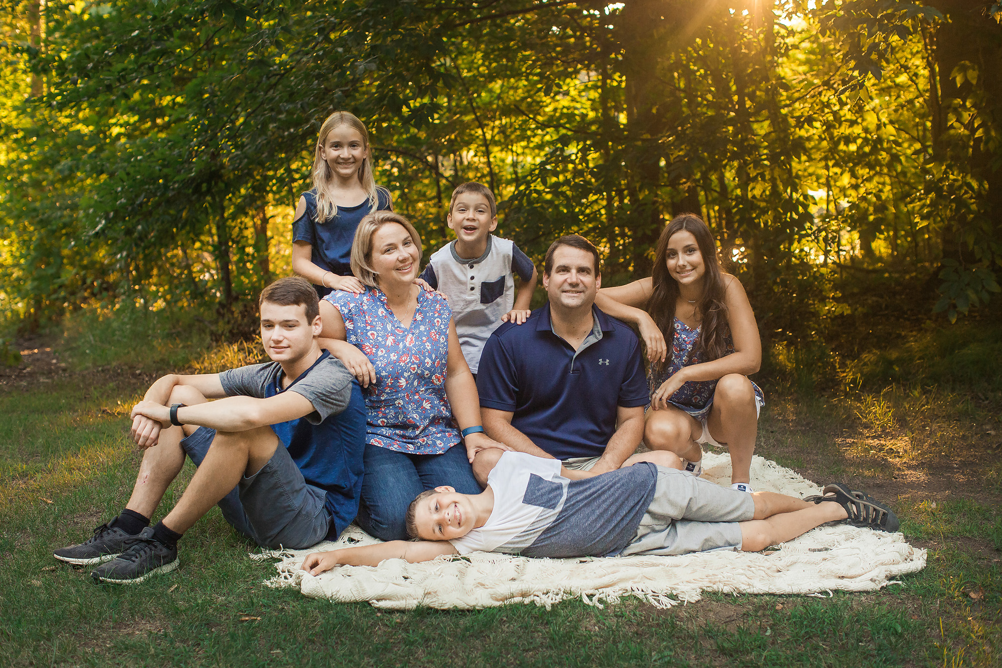 family of seven seated portrait outdoor