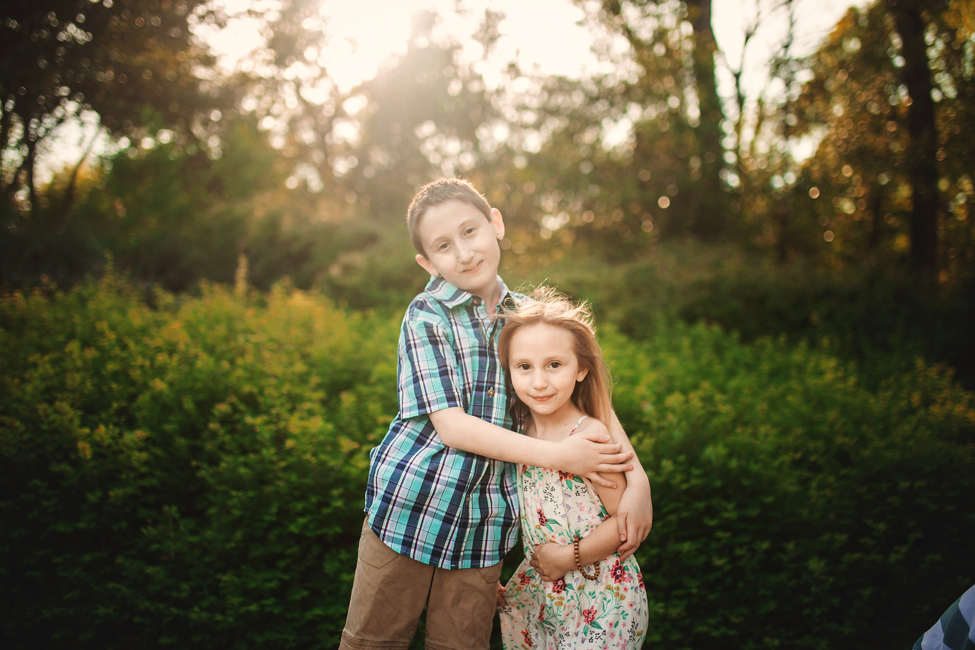 brother and sister hugging portrait