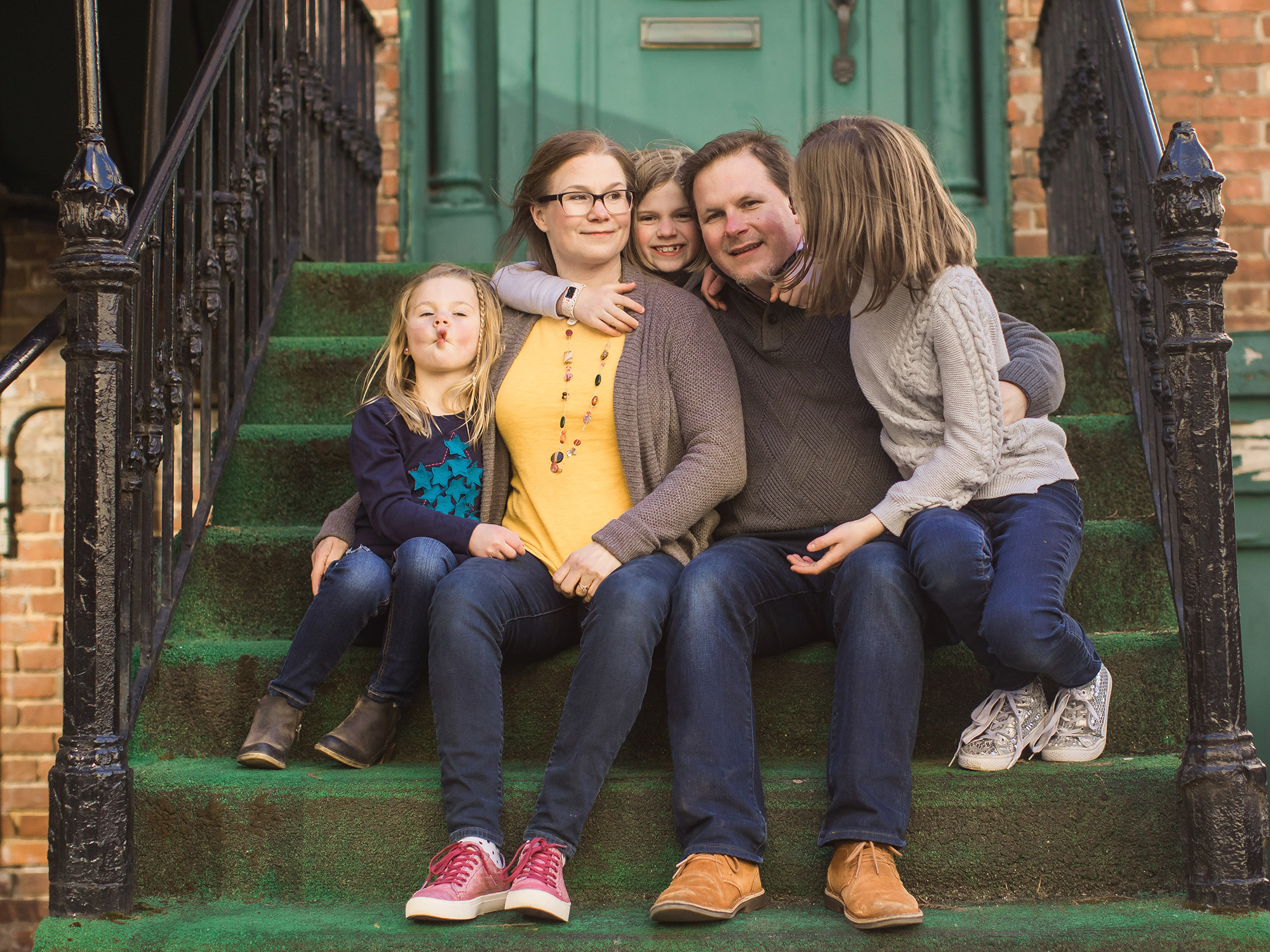 family of five on green steps louisville