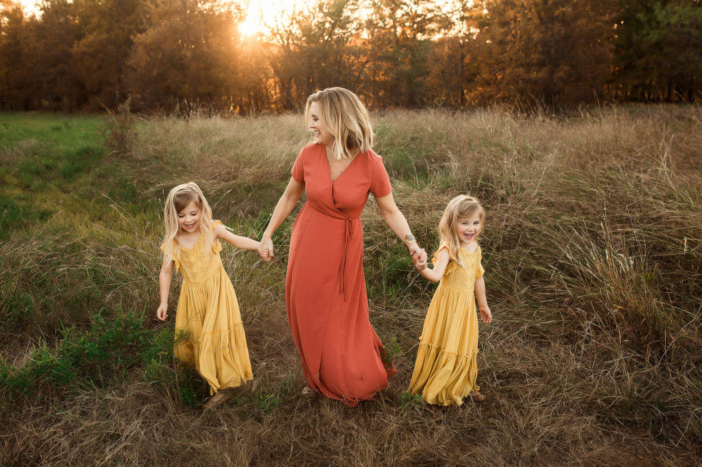 mother dancing with twin daughters
