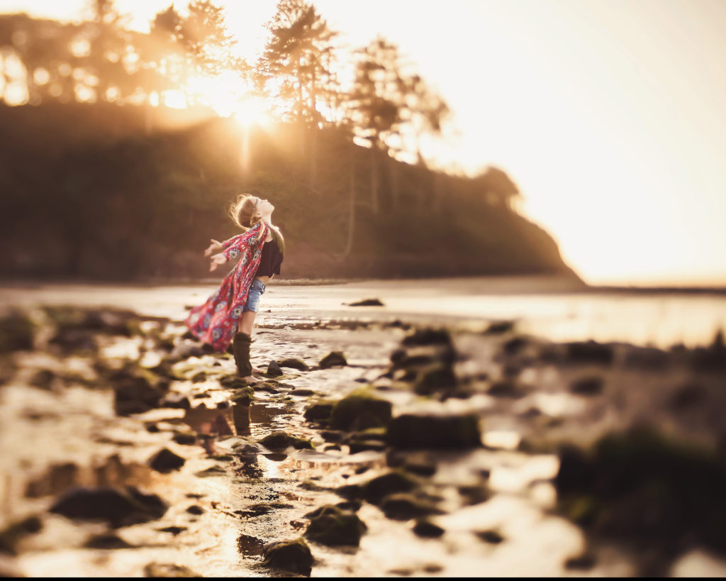 girl standing in sunshine beach oregon