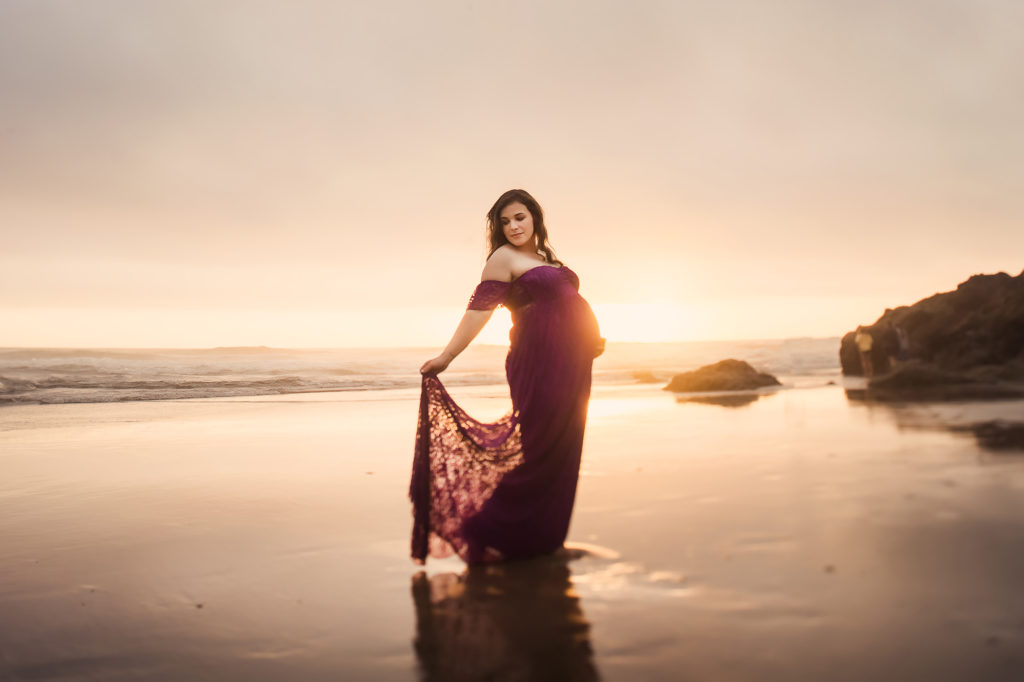 maternity woman purple dress at beach