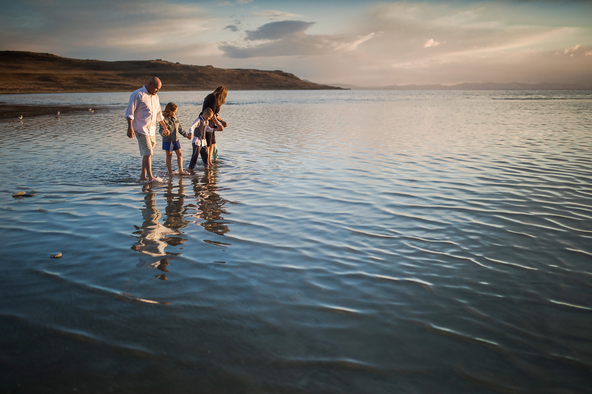 family walking through salt lake sunset
